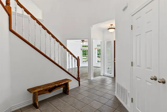 a view of a hallway with staircase