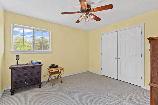 a room with a dresser and a window