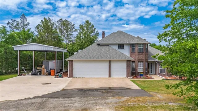 a view of a house with backyard porch and sitting area
