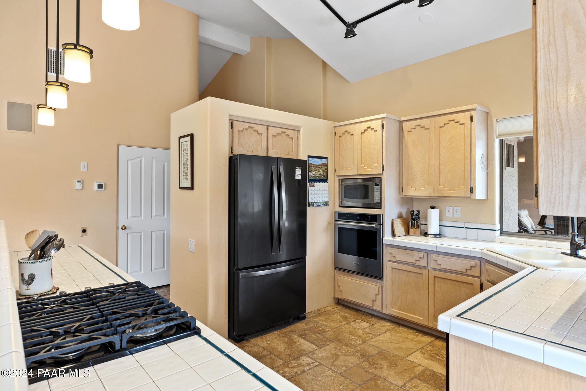 2147 West Post Oak Drive Prescott, AZ 86305 - Photo 13 of 59 a kitchen with a refrigerator sink and stove