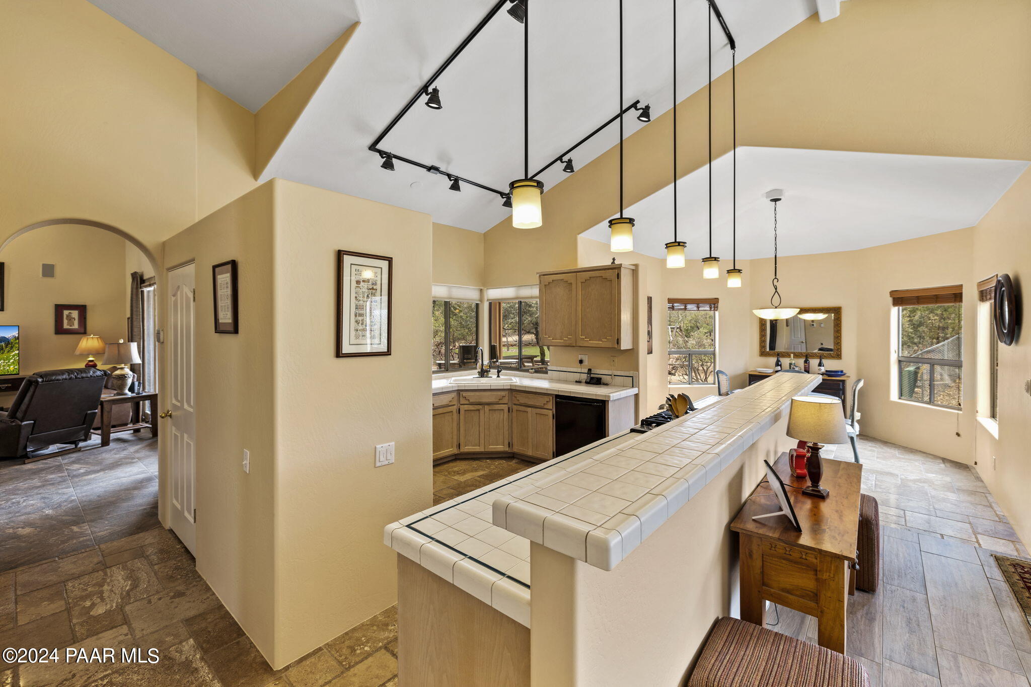 2147 West Post Oak Drive Prescott, AZ 86305 - Photo 16 of 59 a open kitchen with stainless steel appliances granite countertop a stove and a refrigerator