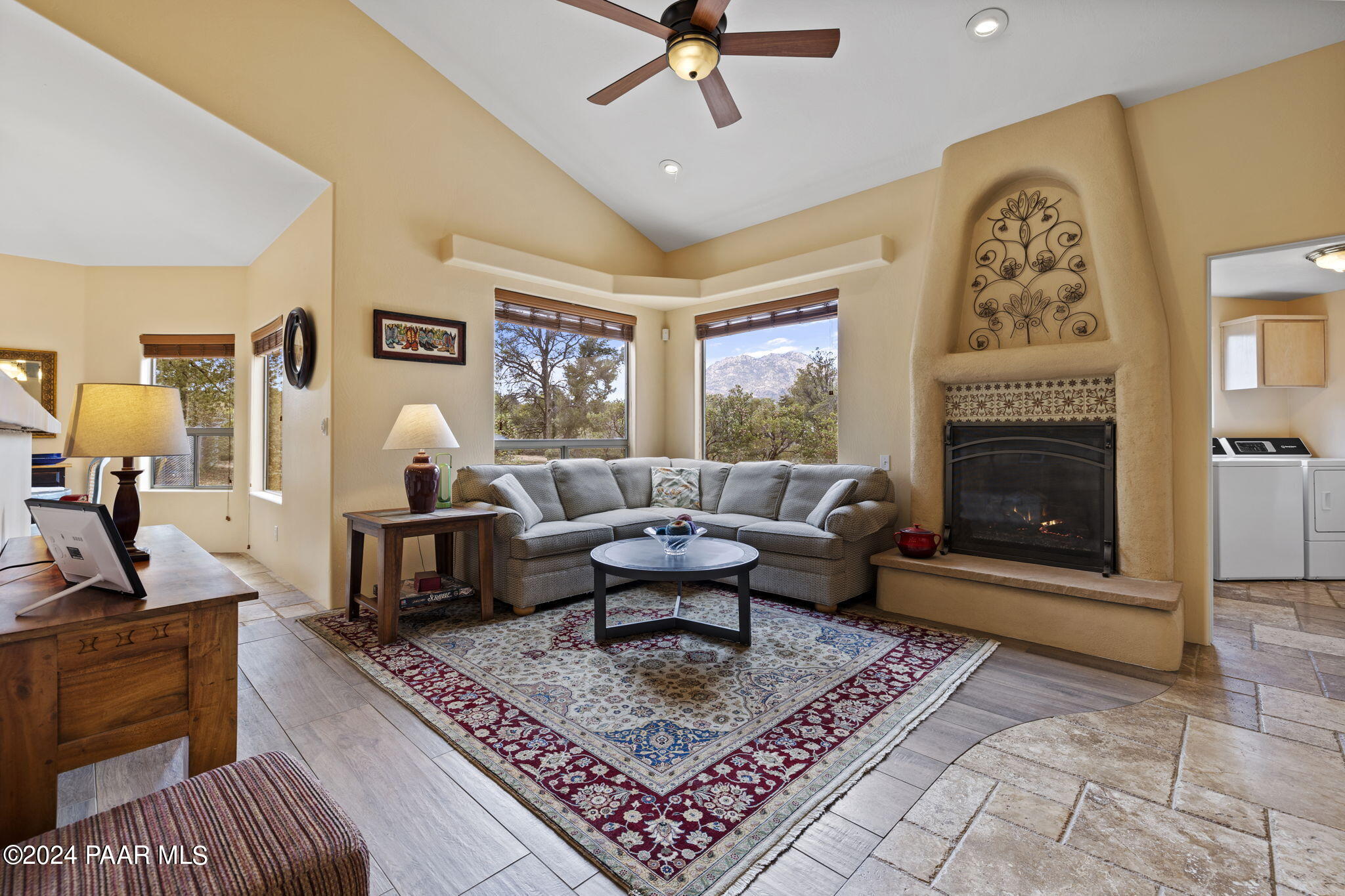 2147 West Post Oak Drive Prescott, AZ 86305 - Photo 18 of 59 a living room with furniture a rug and a fireplace