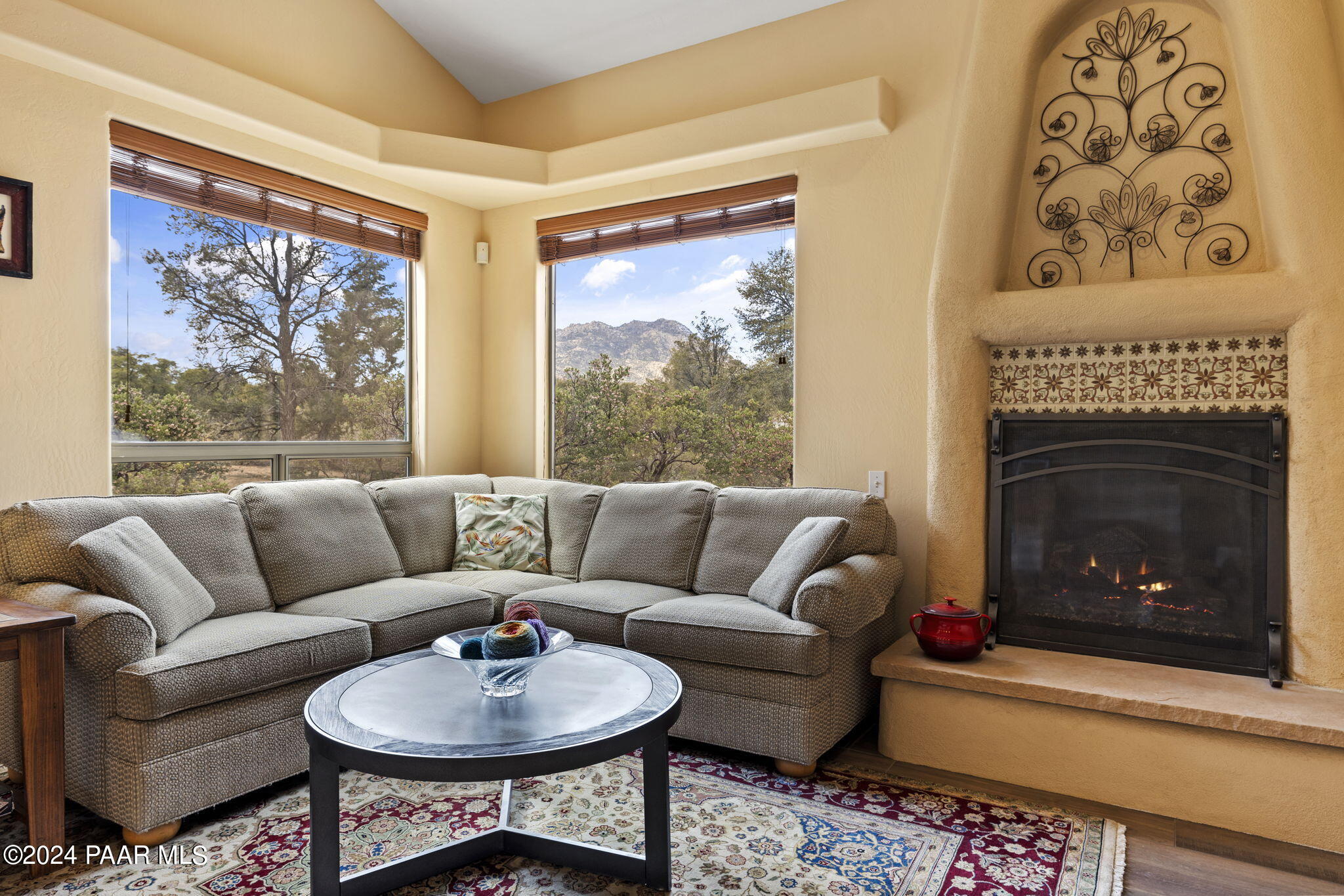 2147 West Post Oak Drive Prescott, AZ 86305 - Photo 19 of 59 a living room with furniture a large window and a fireplace