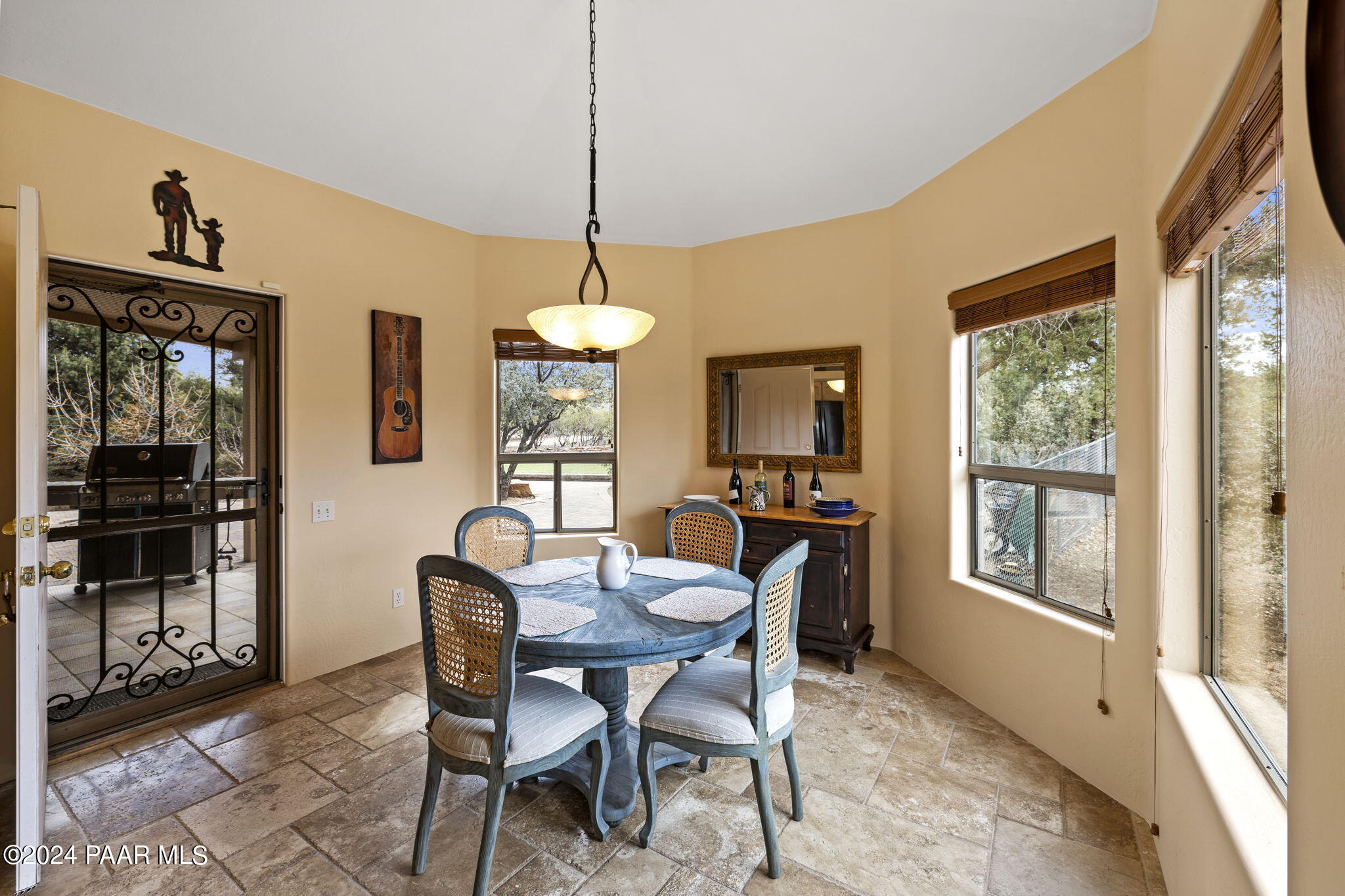 2147 West Post Oak Drive Prescott, AZ 86305 - Photo 20 of 59 a view of a dining room with furniture window and wooden floor