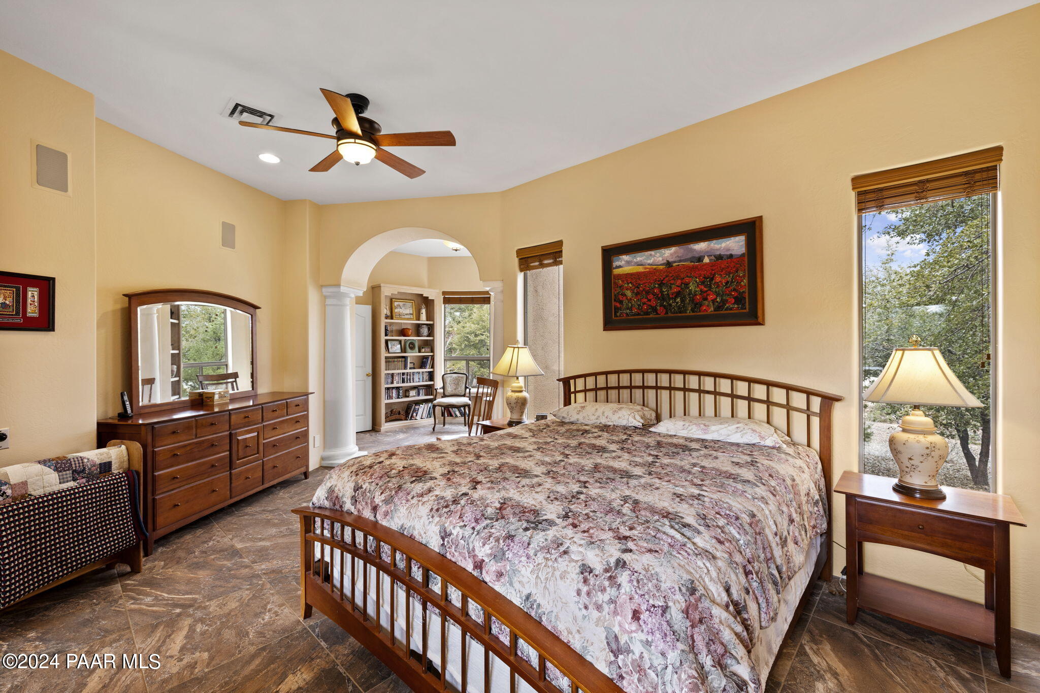 2147 West Post Oak Drive Prescott, AZ 86305 - Photo 24 of 59 a bedroom with a large bed and a chandelier