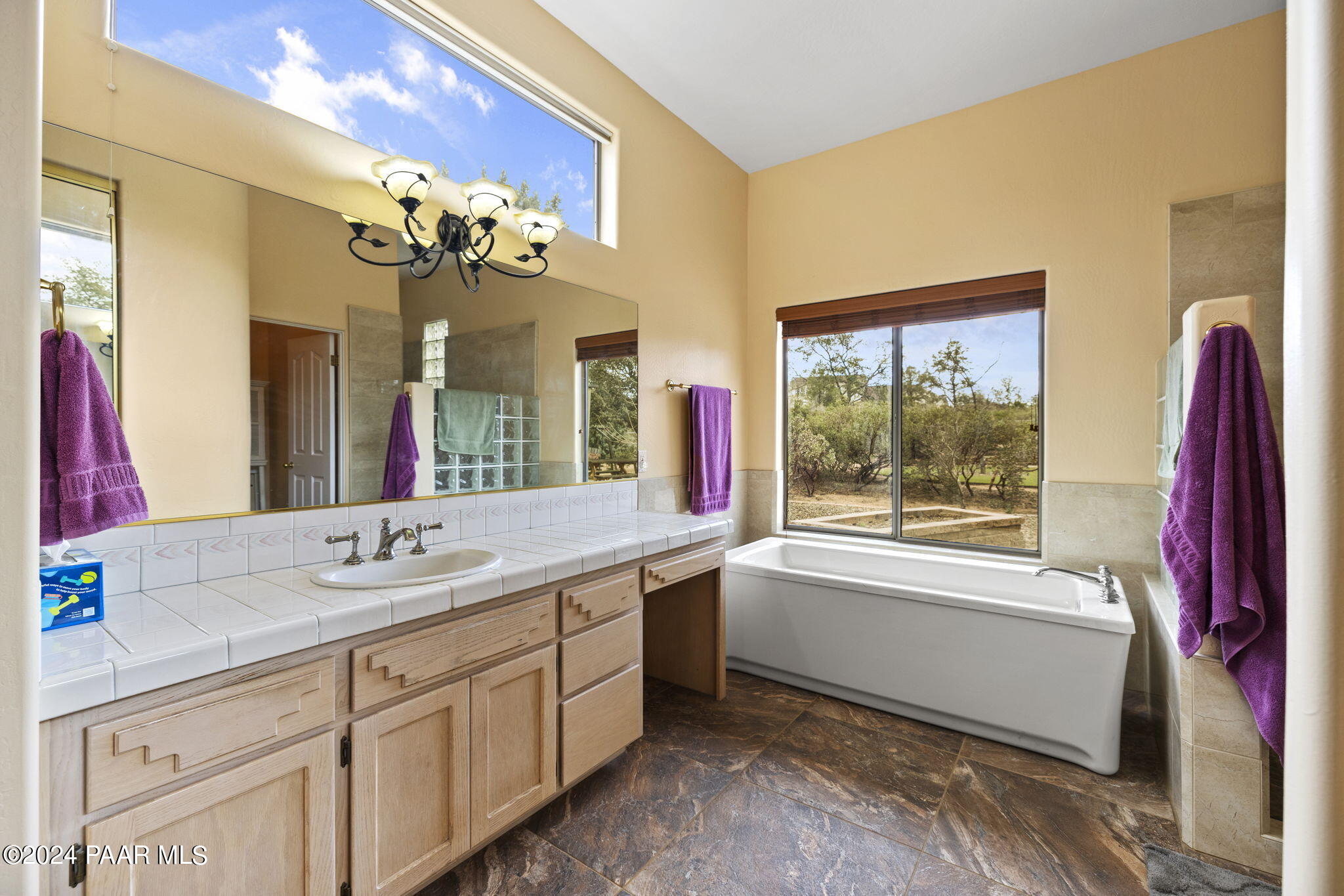 2147 West Post Oak Drive Prescott, AZ 86305 - Photo 28 of 59 a bathroom with a tub sink and mirror