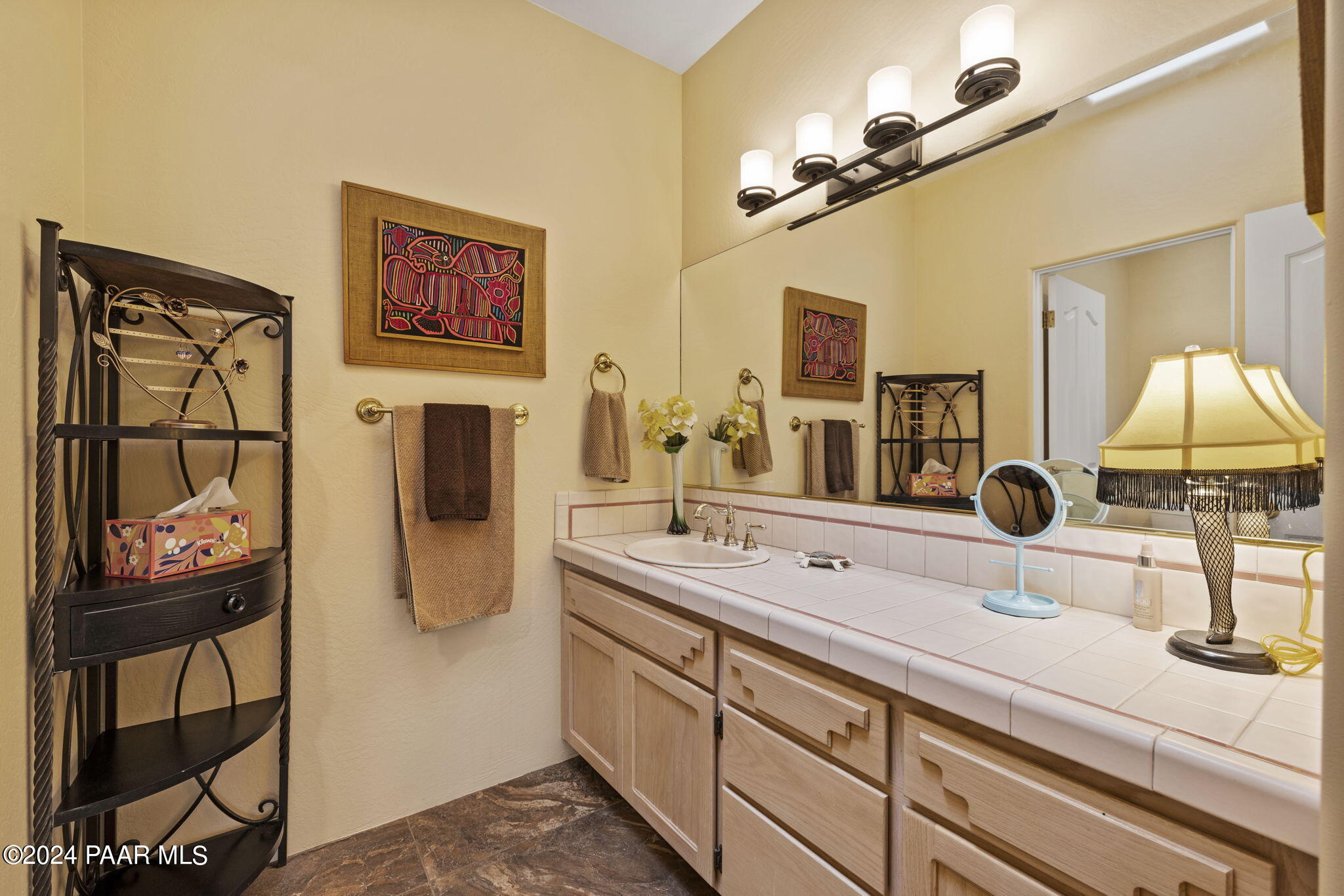 2147 West Post Oak Drive Prescott, AZ 86305 - Photo 37 of 59 a bathroom with a sink and a mirror