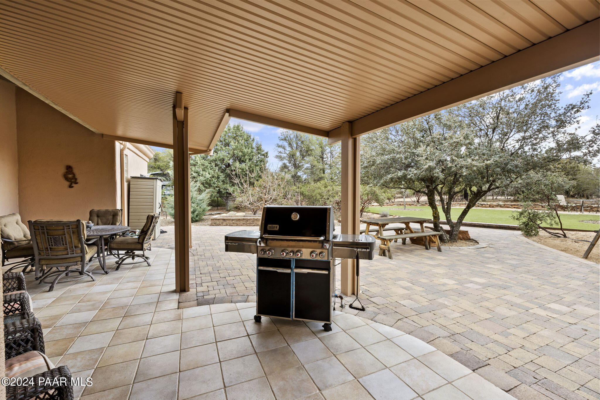 2147 West Post Oak Drive Prescott, AZ 86305 - Photo 44 of 59 a view of a chairs and table in patio with a backyard