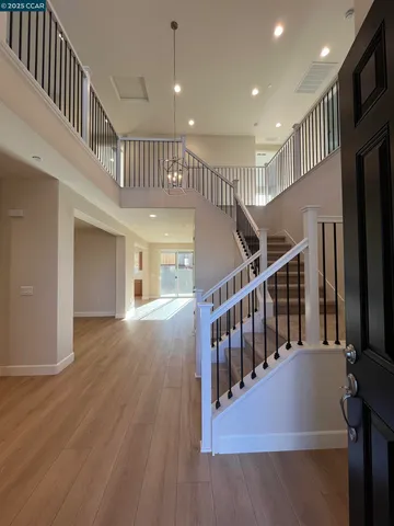 a view of entryway with wooden floor