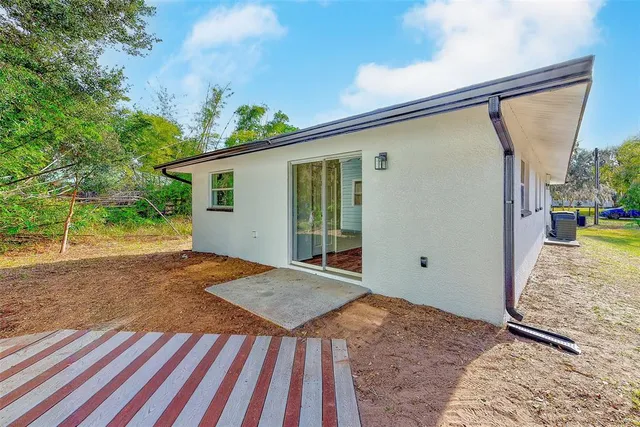 a view of a back yard of the house