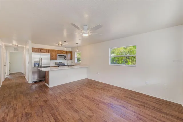 a view of kitchen with wooden floor