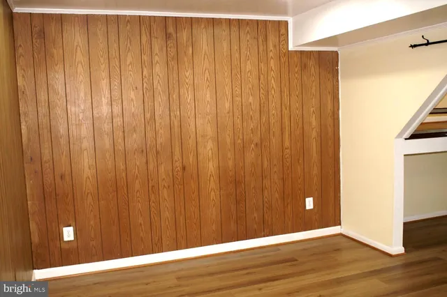 a view of a elevator with wooden floor