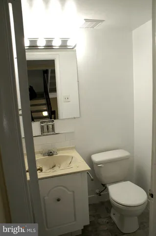 a bathroom with a sink and a toilet