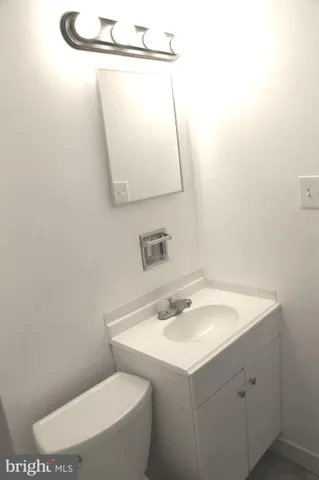 a bathroom with a shower and a sink