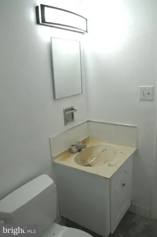 a view of wooden fence and a pathway