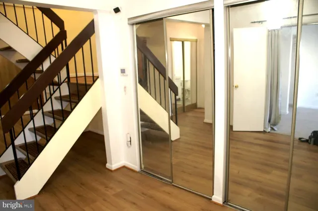 a view of staircase with wooden floor and stairs