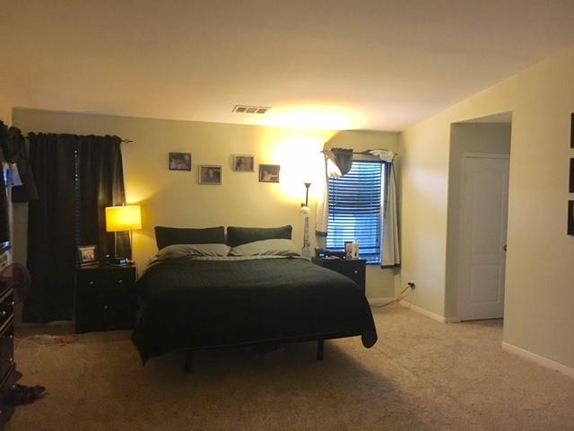 1844 Minter Way Lancaster, CA 93534 - Photo 14 of 15 a bedroom with bed and window