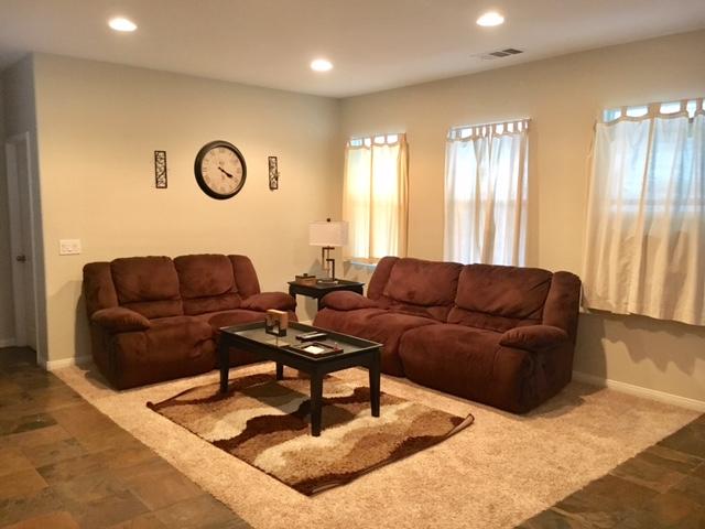 1844 Minter Way Lancaster, CA 93534 - Photo 6 of 15 a living room with furniture and a large window