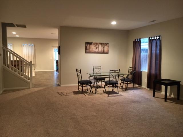 1844 Minter Way Lancaster, CA 93534 - Photo 7 of 15 a living room with furniture and a dining table