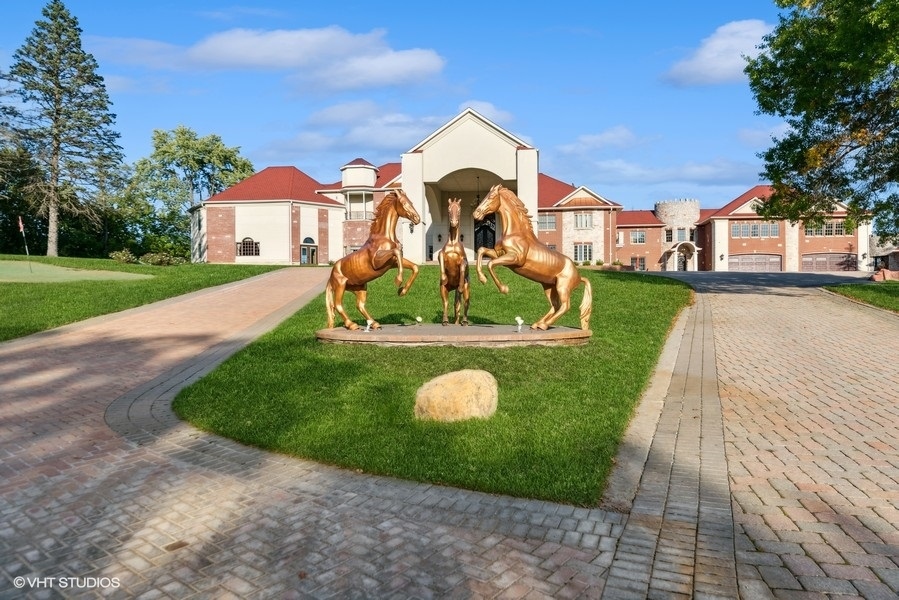 24575 Illinois Rte 59 Barrington, IL 60010 - Photo 1 of 60 a front view of a house with a yard and garage