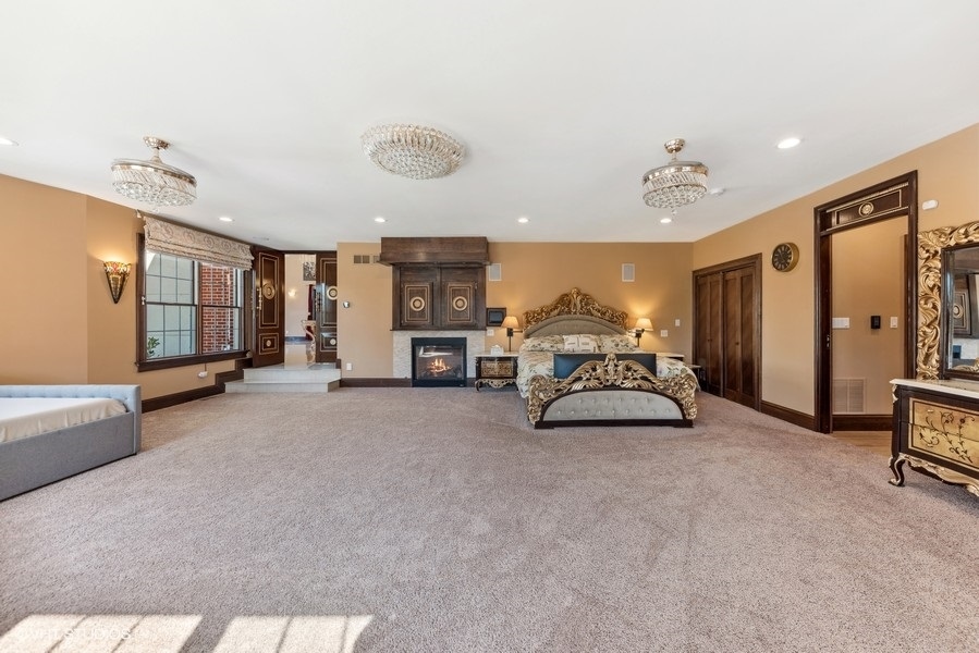 24575 Illinois Rte 59 Barrington, IL 60010 - Photo 19 of 60 a spacious bedroom with a bed and a view of bedroom