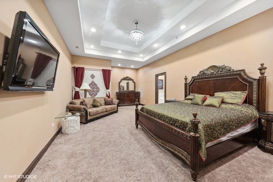 24575 Illinois Rte 59 Barrington, IL 60010 - Photo 28 of 60 a bedroom with a bed and flat screen tv