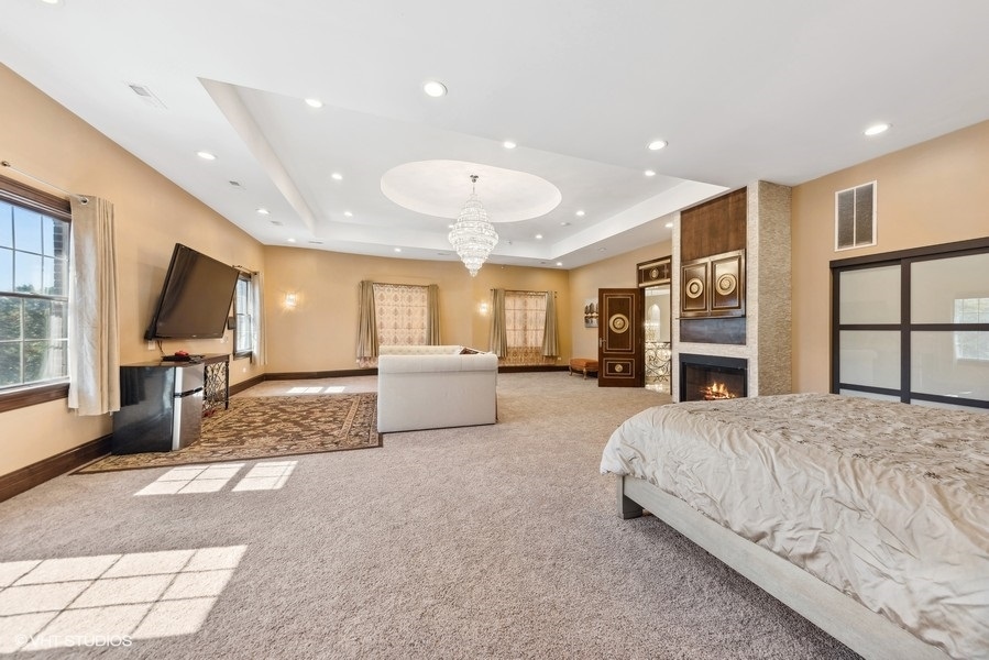 24575 Illinois Rte 59 Barrington, IL 60010 - Photo 30 of 60 a spacious bedroom with a large bed and a large window