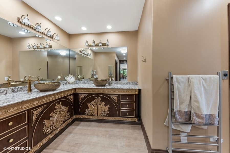 24575 Illinois Rte 59 Barrington, IL 60010 - Photo 31 of 60 a spacious bathroom with a double vanity sink a mirror and a shower