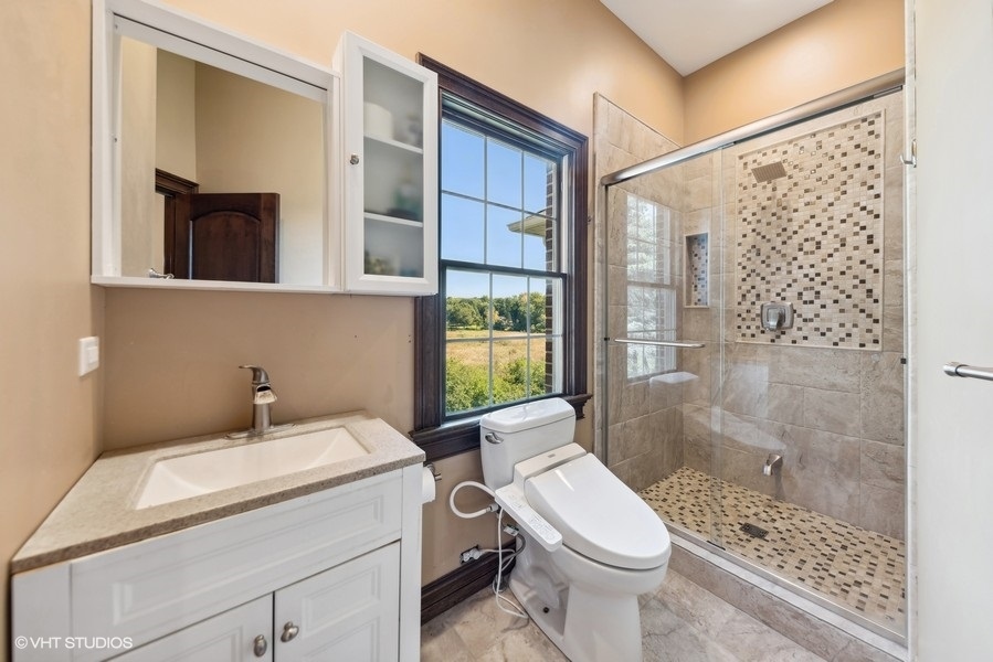 24575 Illinois Rte 59 Barrington, IL 60010 - Photo 36 of 60 a bathroom with a sink toilet and shower