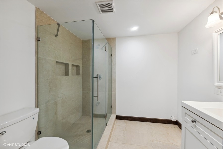 24575 Illinois Rte 59 Barrington, IL 60010 - Photo 37 of 60 a bathroom with a shower and a toilet