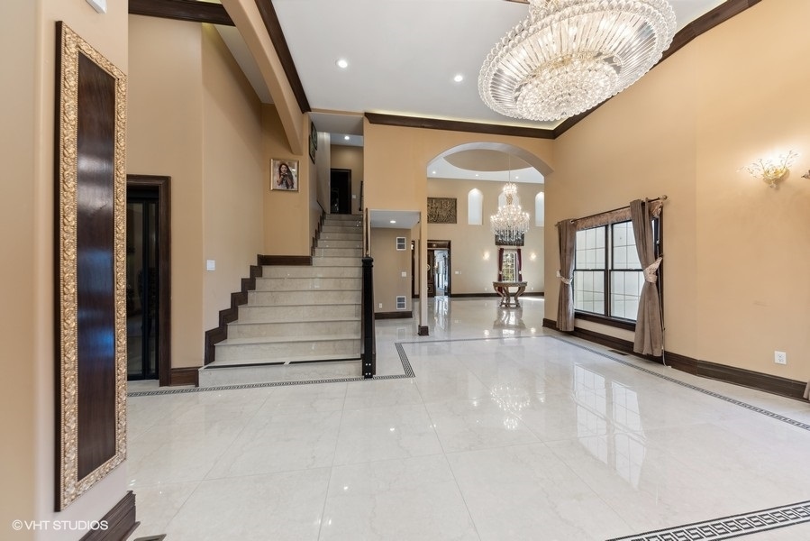 24575 Illinois Rte 59 Barrington, IL 60010 - Photo 4 of 60 a view of entryway and hall with wooden floor