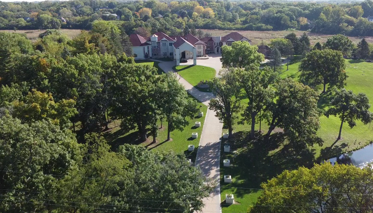 24575 Illinois Rte 59 Barrington, IL 60010 - Photo 41 of 60 a aerial view of a house with a yard and a garden