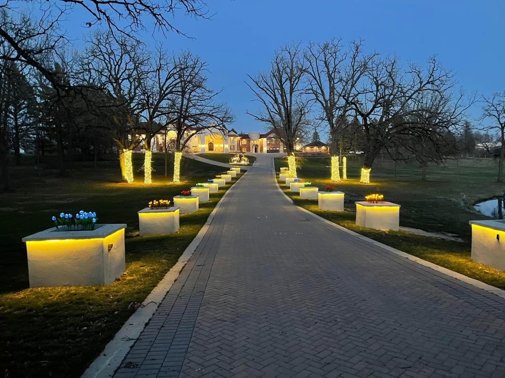 24575 Illinois Rte 59 Barrington, IL 60010 - Photo 54 of 60 a view of a patio with couches chairs and a fire pit with large trees