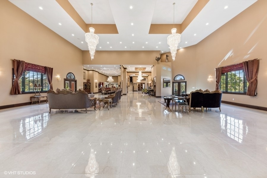 24575 Illinois Rte 59 Barrington, IL 60010 - Photo 8 of 60 a living room with furniture and a chandelier