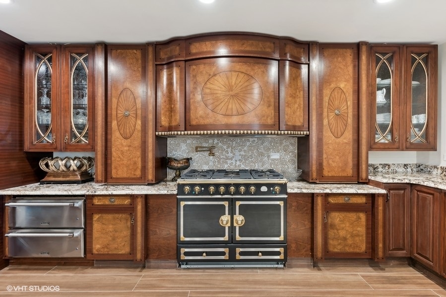 24575 Illinois Rte 59 Barrington, IL 60010 - Photo 10 of 60 a kitchen with stainless steel appliances wooden cabinets and a stove top oven