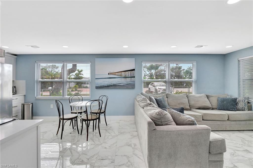 1009 Ridge Street Naples, FL 34103 - Photo 11 of 30 Living room featuring light marble finish flooring and recessed lighting