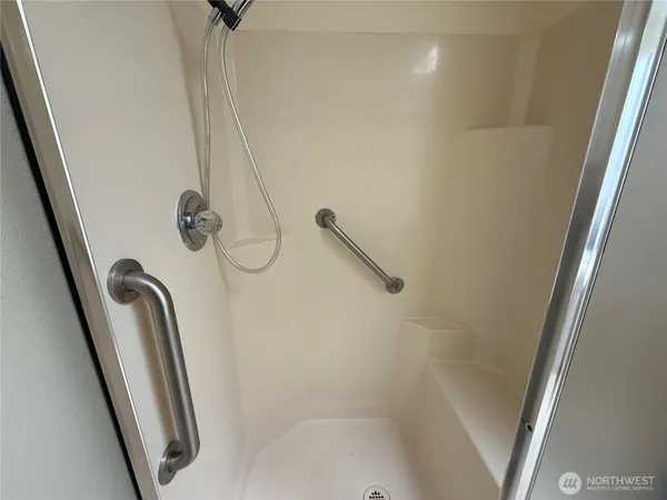 a bathroom with a sink a mirror and a vanity