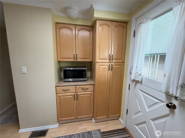 a view of a kitchen from the hallway
