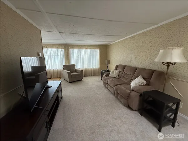 a living room with furniture and a couch