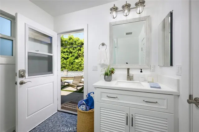 a bathroom with a shower and a sink