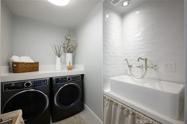 a view of a house with a yard patio and fire pit