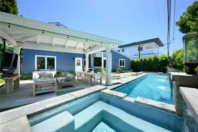 a view of swimming pool with chairs