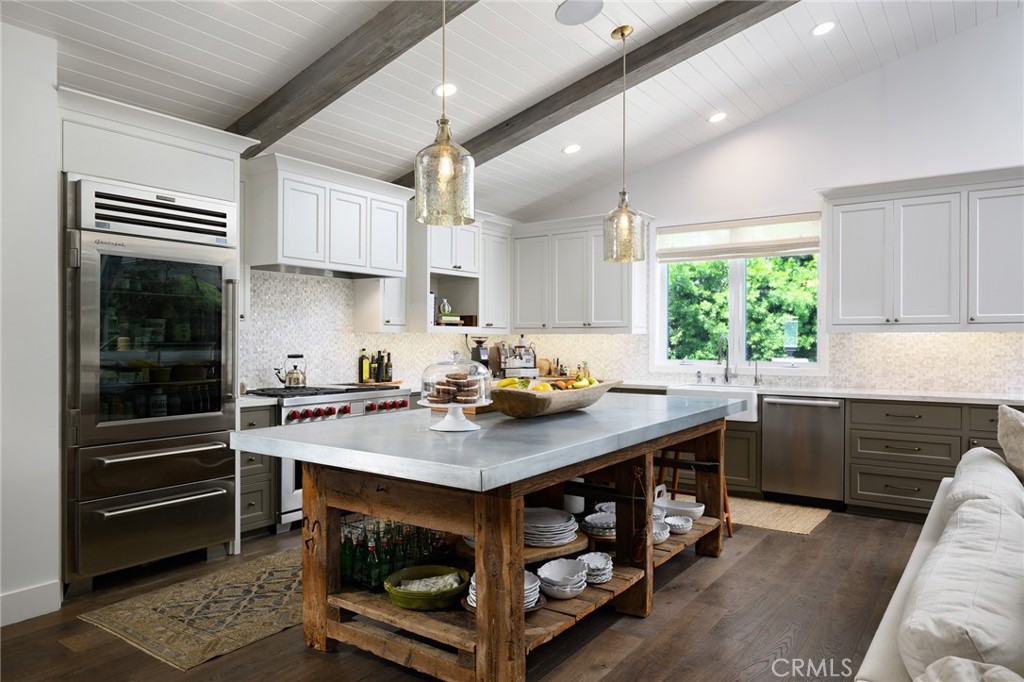 519 Signal Road Newport Beach, CA 92663 - Photo 9 of 40 a kitchen with a stove a sink and a window