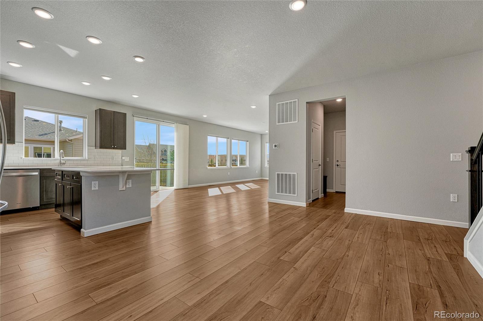15902 Stringhalt Way Parker, CO 80134 - Photo 11 of 48 a view of a kitchen with a sink and a refrigerator