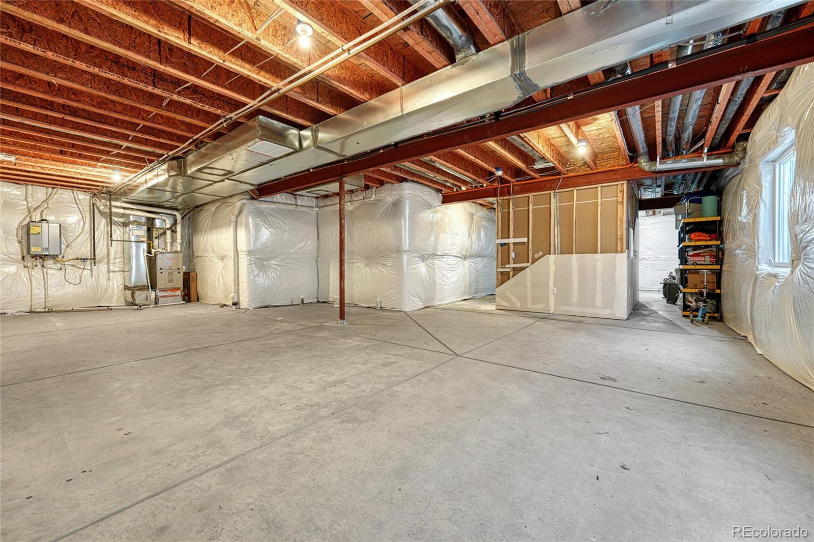 15902 Stringhalt Way Parker, CO 80134 - Photo 24 of 48 a view of empty room with wooden ceiling