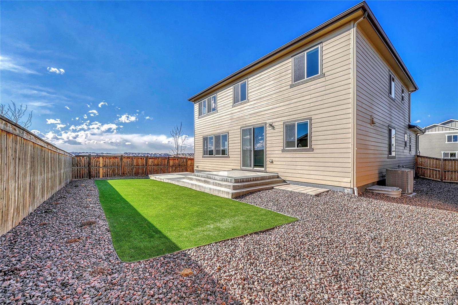 15902 Stringhalt Way Parker, CO 80134 - Photo 42 of 48 a view of a house with backyard and sitting area