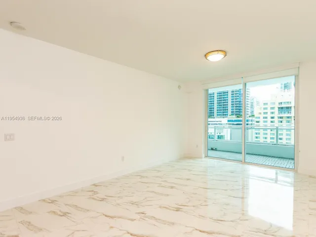 a kitchen with a refrigerator and a sink