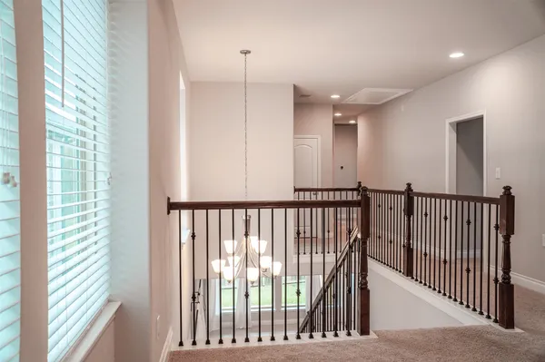 a view of a hallway with windows