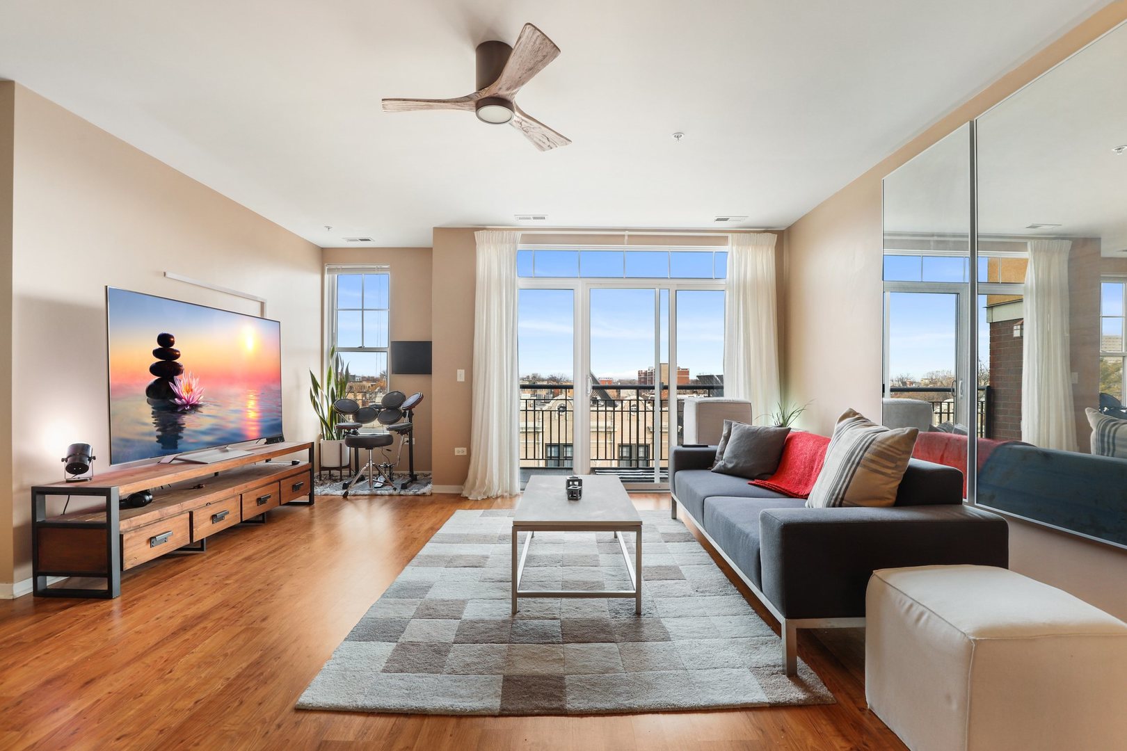 7243 Madison Street, Unit 421 Forest Park, IL 60130 - Photo 2 of 21 a living room with furniture and a flat screen tv