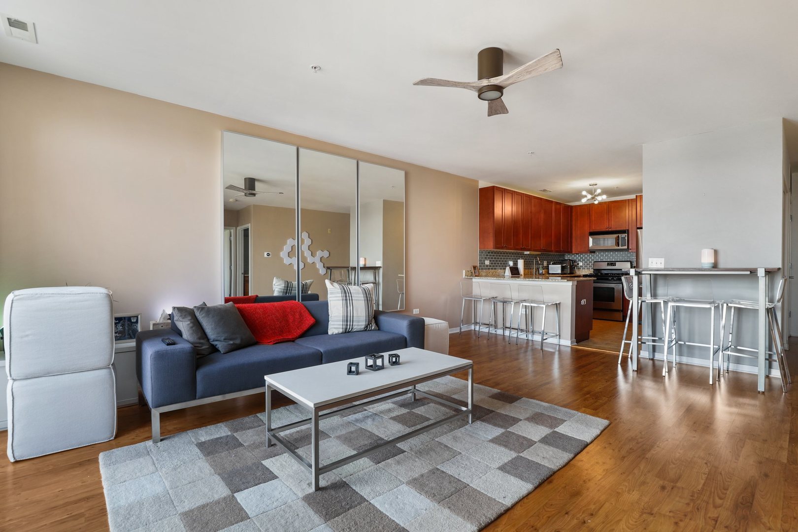 7243 Madison Street, Unit 421 Forest Park, IL 60130 - Photo 7 of 21 a living room with furniture and a wooden floor